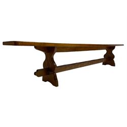 Gnomeman - adzed oak narrow bench, rectangular seat on shaped end supports united by pegged stretcher, carved with gnome signature, by Thomas Whittaker, Little Beck 