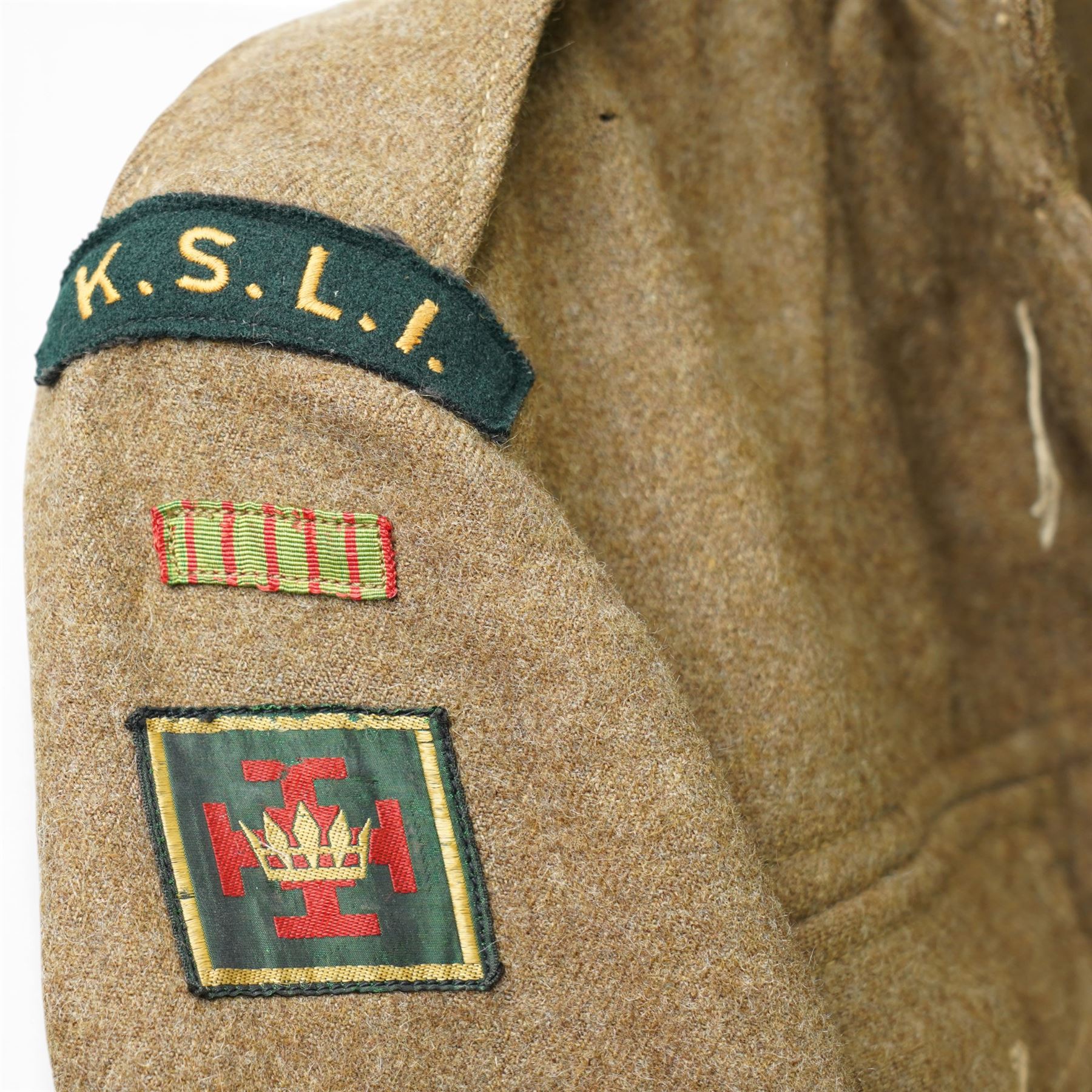 Kings Shropshire Light Infantry 1949 pattern tunic with Croix de Guerre flash and a Rifle Officer's mess tunic and waistcoat with green facings (2)