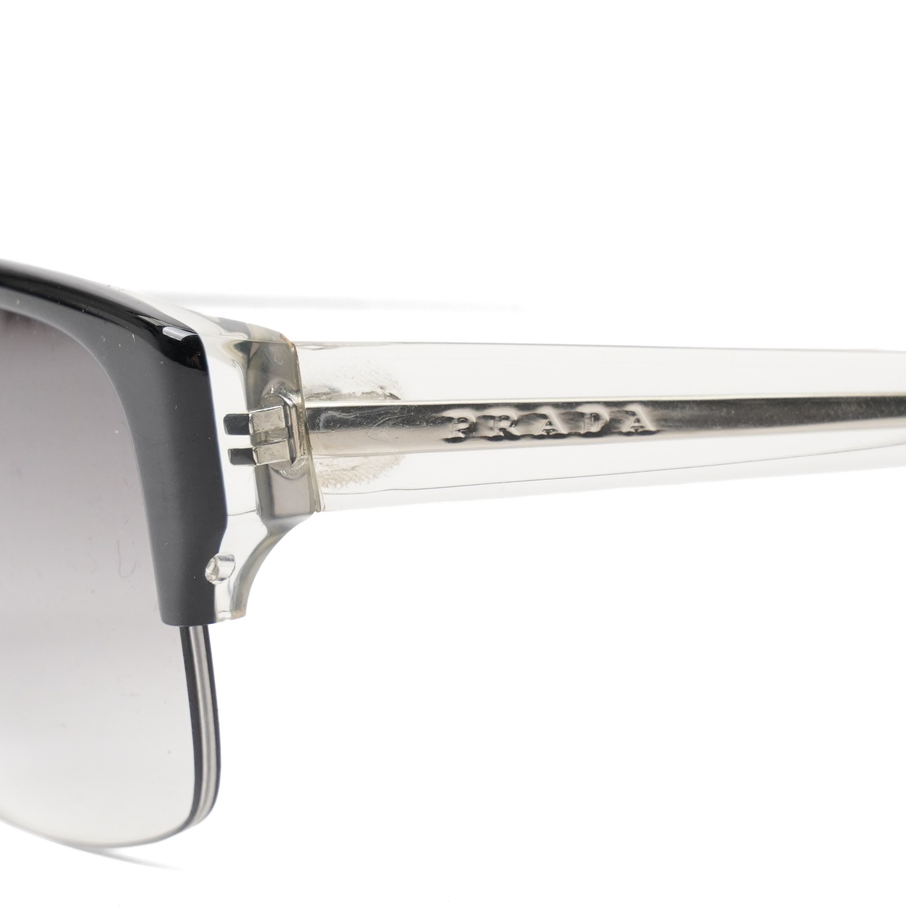 Prada - half-rim sunglasses with black acetate upper frame, clear acetate and silver-tone metal temples, graduated smoke lenses and PRADA lettering to the arms, in original hard case