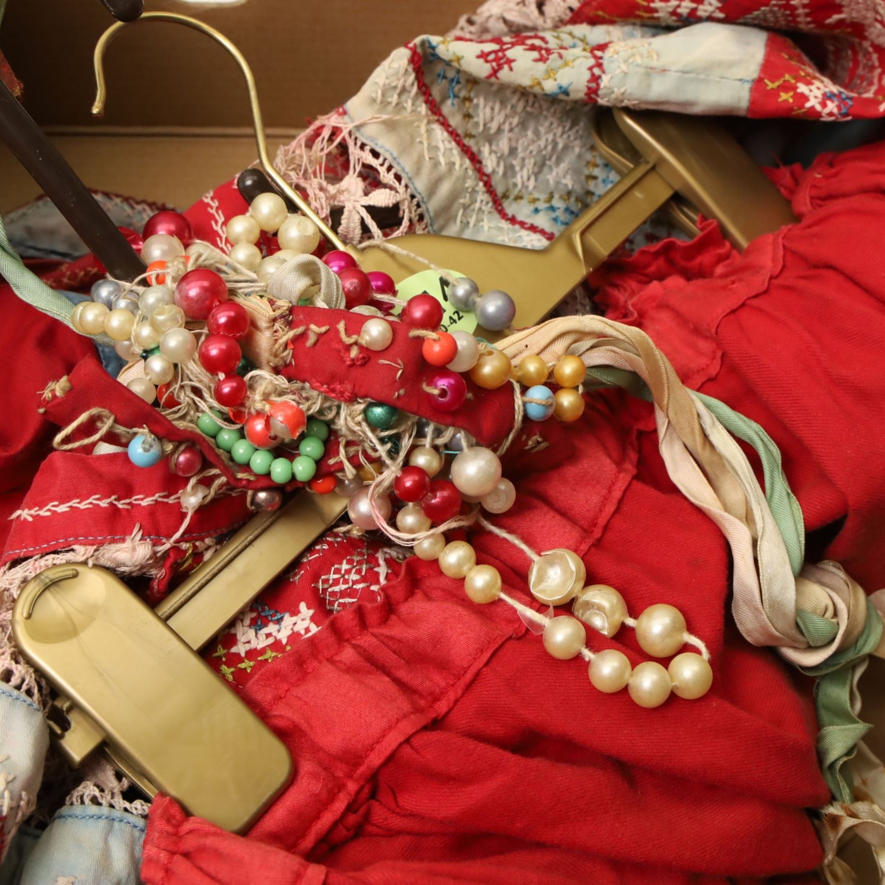 Hand-made clothing, possibly German, together with a postcard album - correspondence between Hubert and his brother Norman in Germany, pre First World War