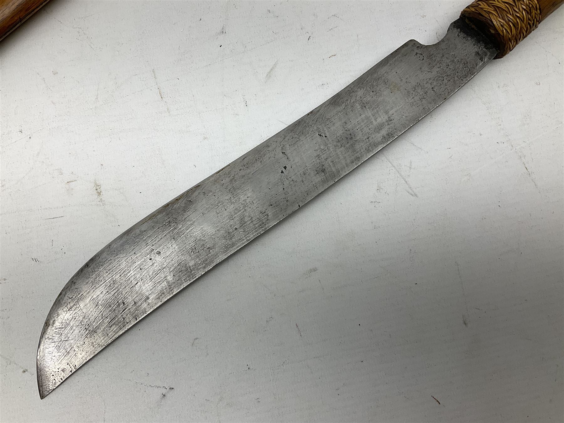 Malaysian parang survival knife the 29cm steel blade with character marks, cane bound teak grip carved with a stylised turtle head to the pommel, with matching teak scabbard L46cm overall