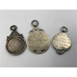 Ten early 20th century silver cartouche fobs, to include a Yorkshire Rose example, all hallmarked with various dates and makers
