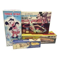 Mickey Mouse Trick Star battery operated drummer figure; Illco Mickey Mouse battery operated Fun Castle Roller Coaster; battery operated Western Express Locomotive; and JK Wells Fargo Overland Stage scale model; all boxed (4)