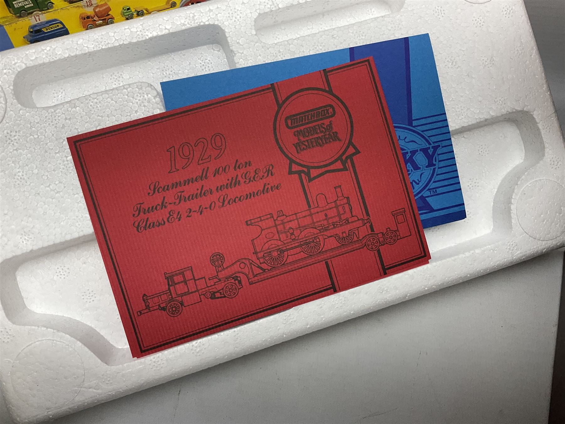 Matchbox - 1929 Scammell 100 ton truck with GER 2-4-0 locomotive; 1936 Leyland Cub Fire-Engine; five Models of Yesteryear; six Dinky Collection vehicles; and Matchbox reference book; together with three Atlas Eddie Stobart vehicles; and three Lledo promotional models; all boxed 