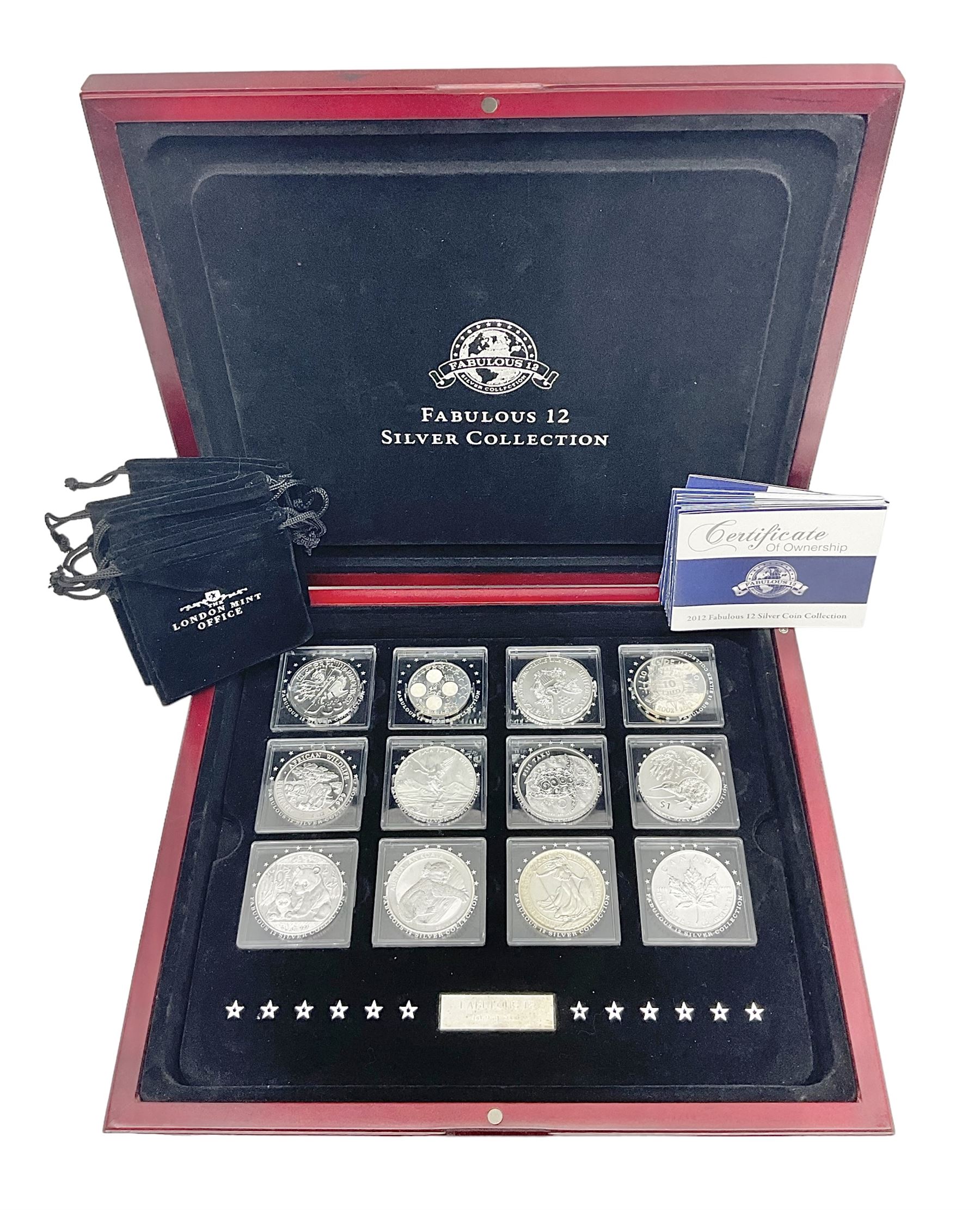 'The 2012 Fabulous 12 Silver Coin Collection' including Queen Elizabeth II Britannia one ounce silver two pound coin, Queen Elizabeth II Canada Maple Leaf one ounce silver five dollar coin, Queen Elizabeth II Australian Koala one ounce silver one dollar coin, Austrian Philharmonic one and a half euro coin, etc., in wooden presentation case