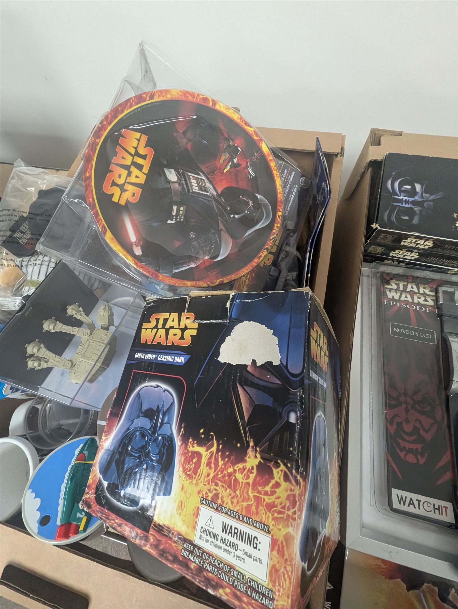 Star Wars collectables, including calendars, plate, plastic cups, Darth Vader money bank, VHS tapes, Masterworks lithograph collection, etc together with some Thunderbirds cups, Texas Chainsaw Massacre plush, etc