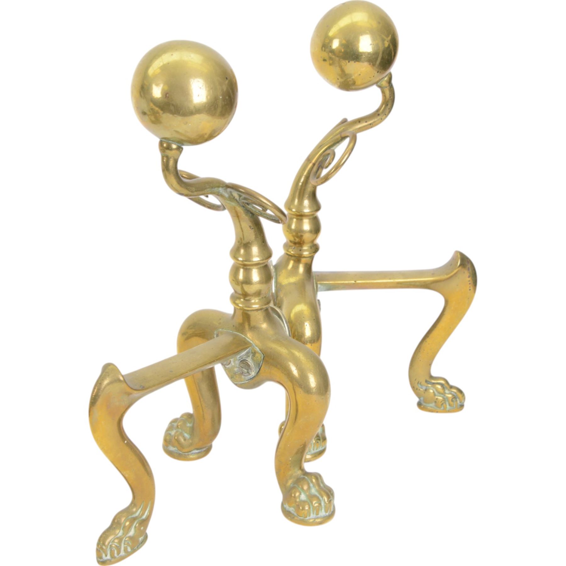 Pair of  Victorian brass fire dogs, decorative brass ball roundels to tops, with a silvered cartouche to the front, raised upon paw feet, together with two other fire dogs, largest H36cm 