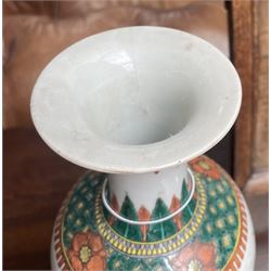 Chinese Kangxi famille verte vase of baluster form with fluted rim, decorated with sage and attendants within a trellis border, with four character Kangxi double ring mark beneath, H31cm 