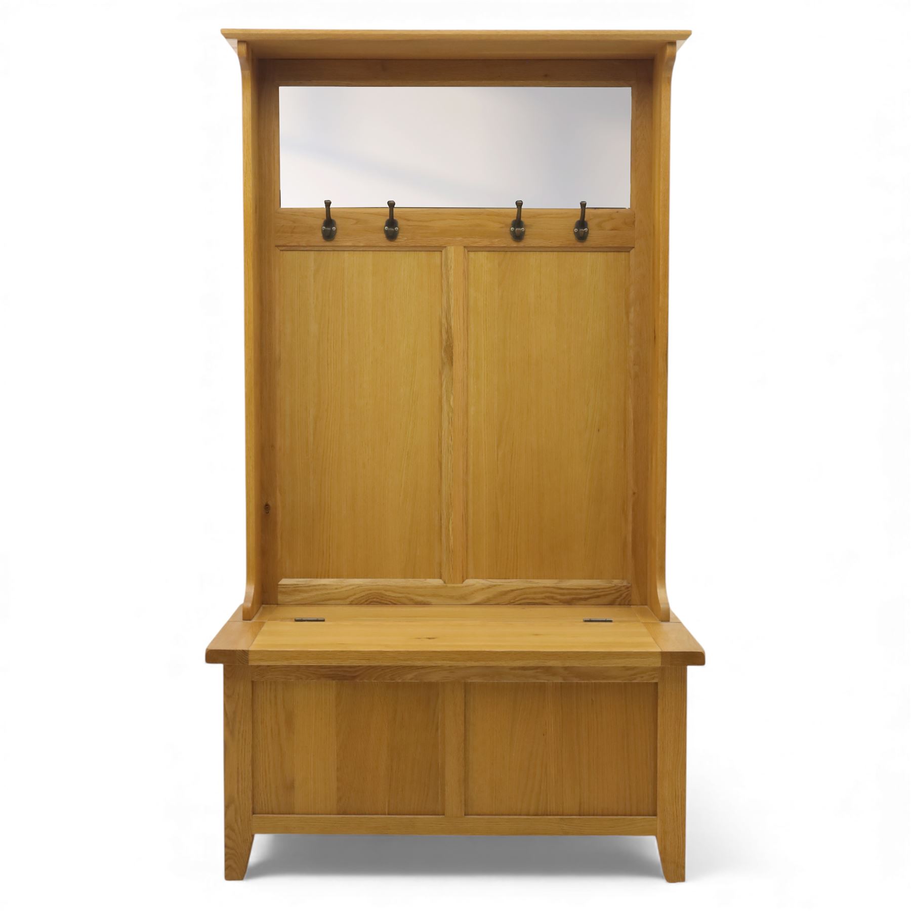 Modern light oak hall bench settle, with moulded cornice above a panelled back fitted with a row of metal coat hooks, over a hinged box seat opening to shoe storage, on tapered legs