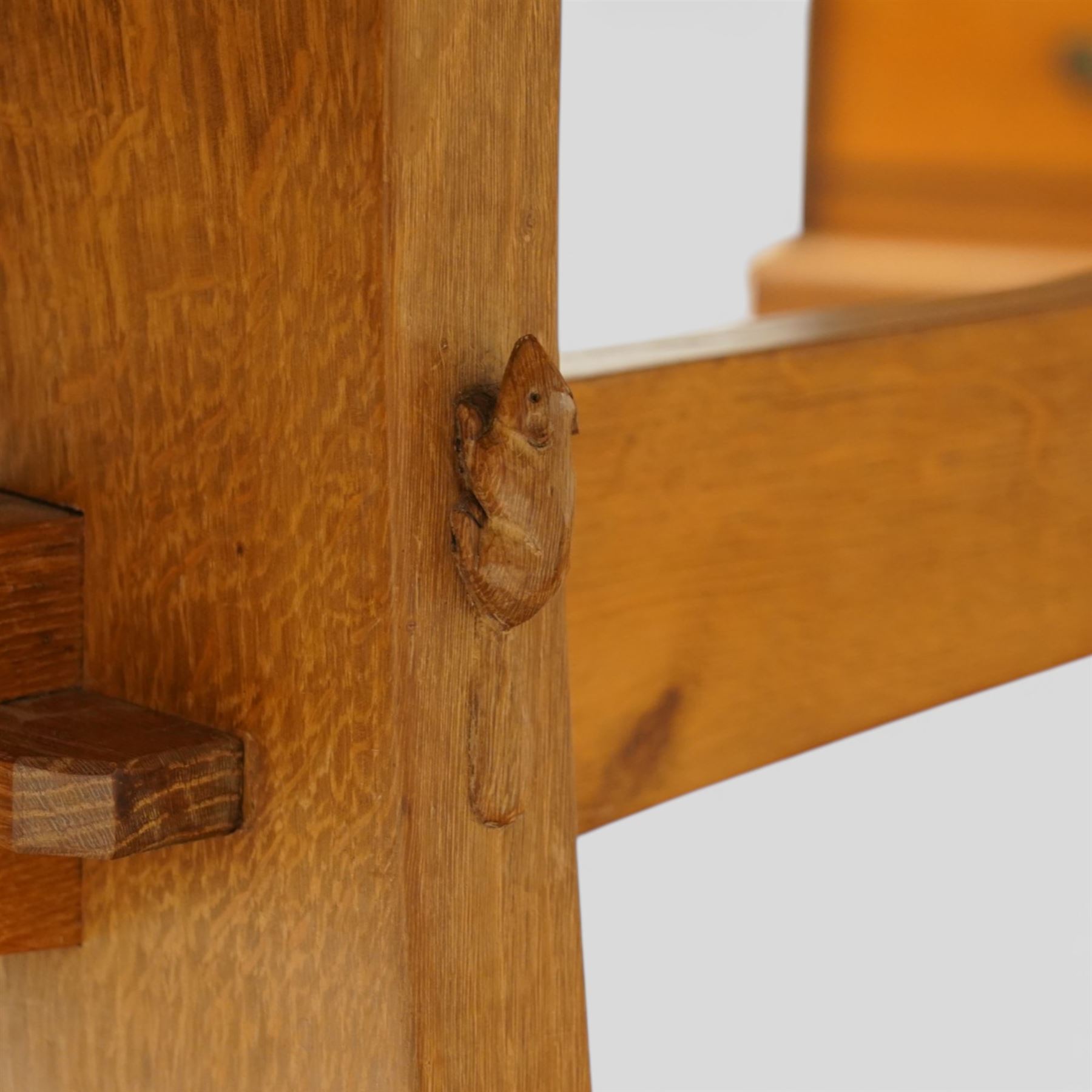 Beaverman - oak adzed top refectory table, the rectangular top raised on twin trestle supports with shaped feet united by a stretcher, the joints secured with exposed pegs, with carved beaver signature, by Colin Almack of Sutton near Thirsk