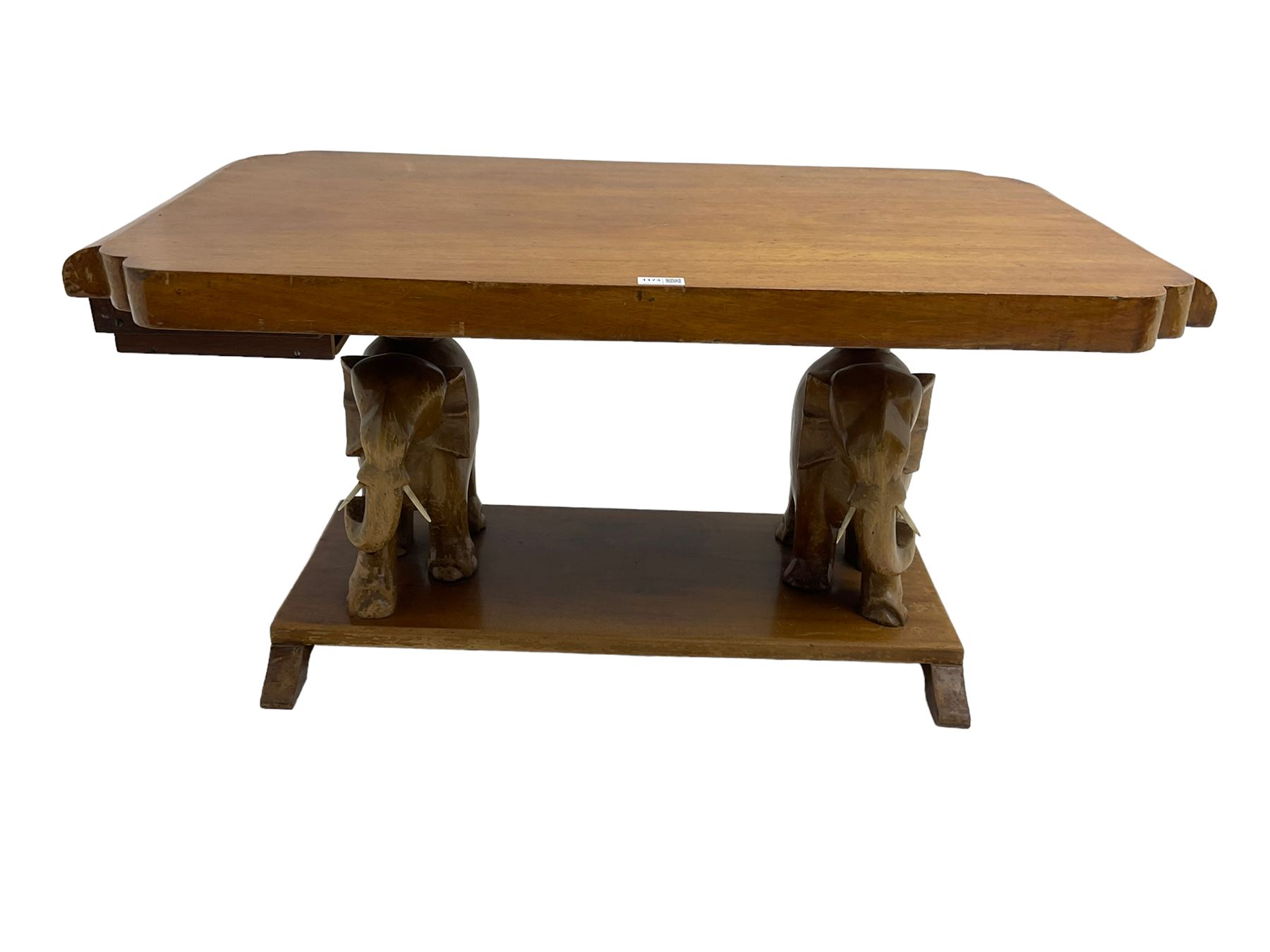 Hardwood coffee table on carved elephant figure supports, platform base on sledge feet