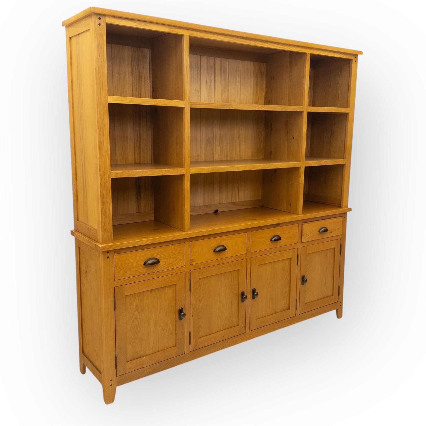 Cotswold & Co - modern light oak dresser, the upper section with open shelving and divided compartments, the base fitted with four drawers over four panelled cupboard doors with metal handles