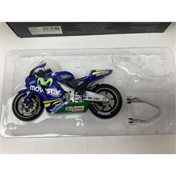 Four Minichamps 1:12 scale die-cast motorcycles - Honda RC211V Team Movistar Honda MotoGP Rider Marco Melandri MotoGP 2005; Yamaha YZR-M1 Antena 3 Yamaha D'Antin Shinya Nakano MotoGP 2003; Yamaha YZR-M1 Max Biaggi MotoGP 2002; and Ducatti 999FO4 Gregorio Lavilla BSB 2005; all boxed (4)