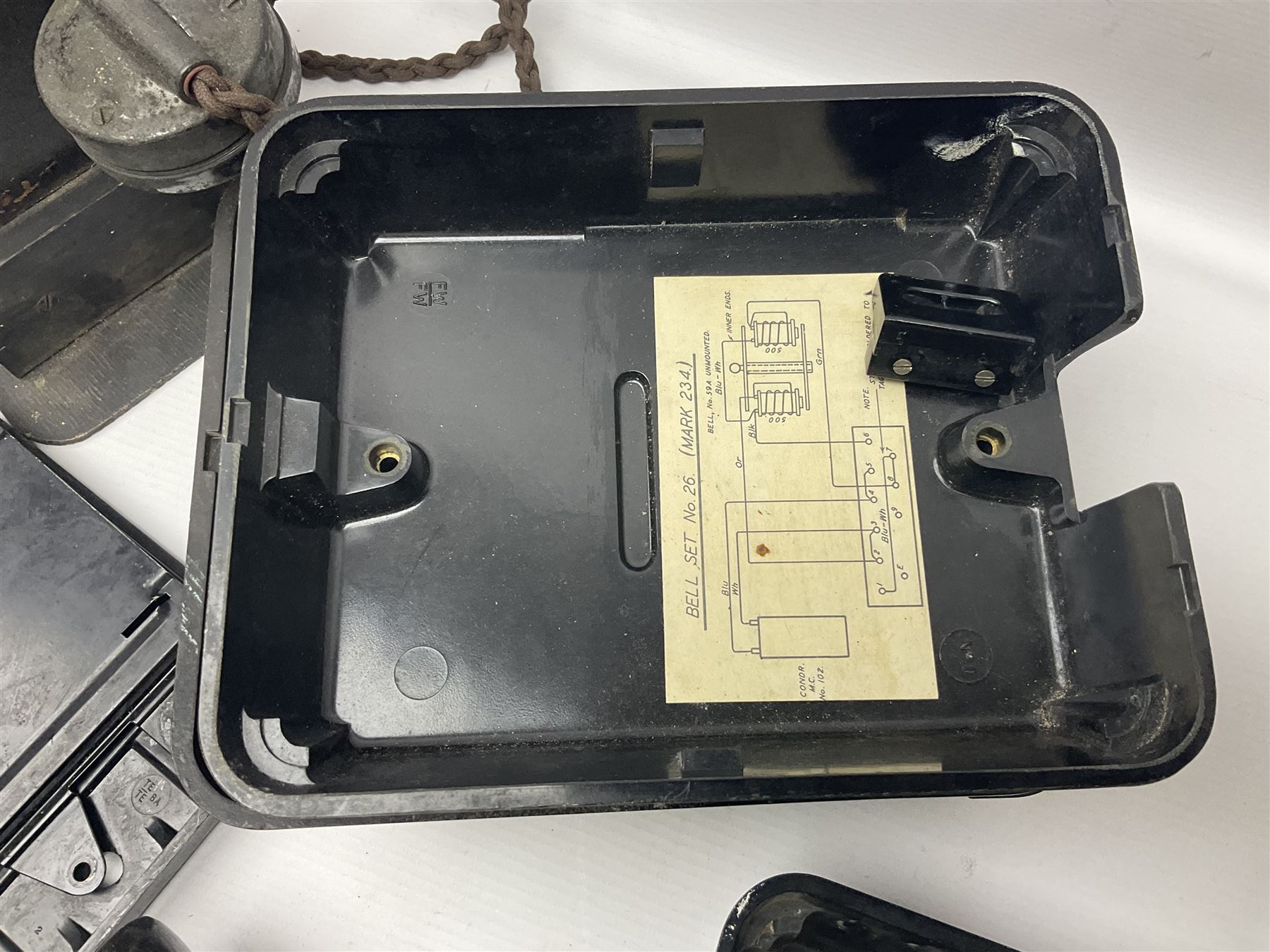 Collection of phone headsets, including GPO bakelite examples, together with other telephone parts 