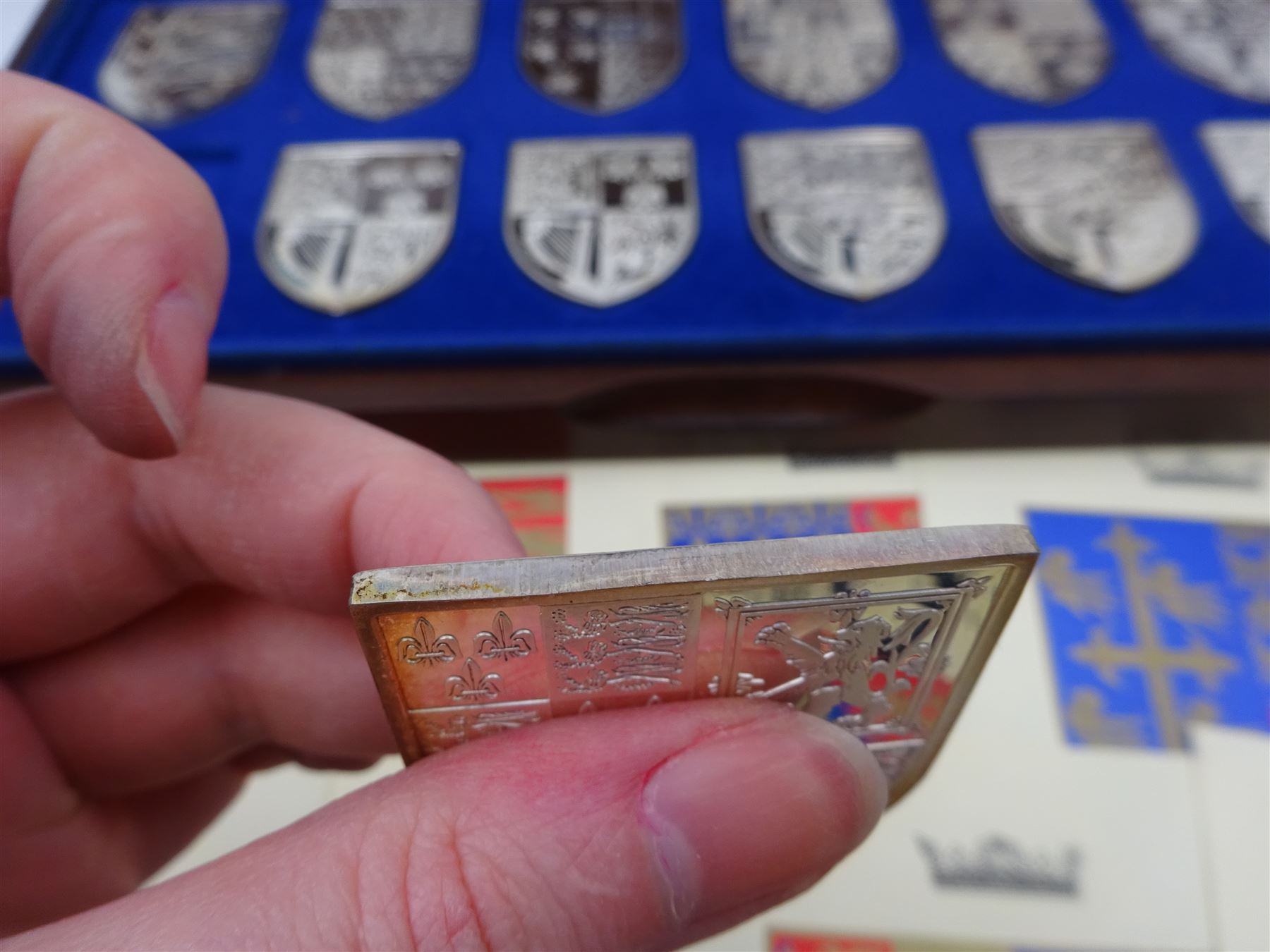 Yorkshire Mint, The Royal Arms Collection, twelve shield shaped silver medallions each depicting variations on the Royal coat of arms, each hallmarked Yorkshire Mint, Birmingham 1976/77, contained within fitted wooden case with associated information cards