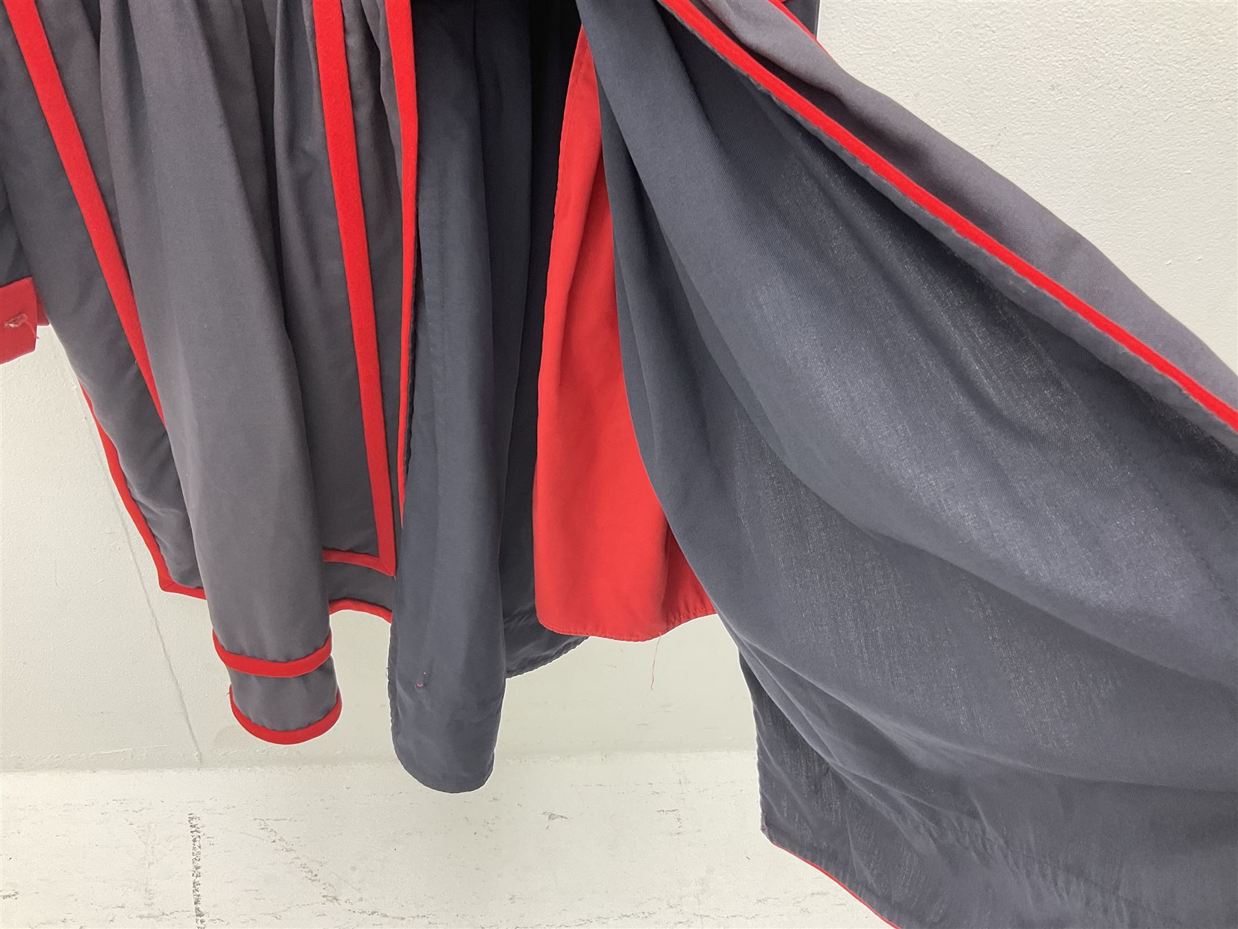 Elizabeth II Yeoman Warders (Beefeater) No.1 Undress blue uniform - comprising tunic bearing label Crown Military Uniforms H.M. Tower of London and bonnet by S. Patey (2) 