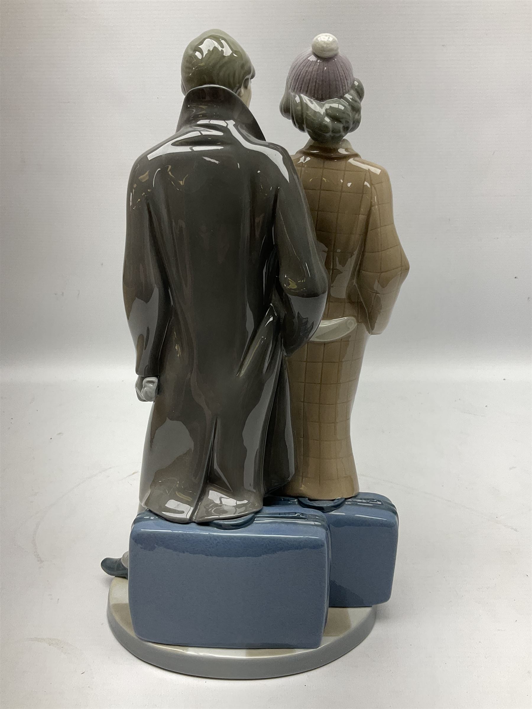 Lladro figure, Sad Parting, modelled as a man and woman with suitcases, sculpted by Francisco Catalá, with original box, no 5583, year issued 1989, year retired 1991, H33cm