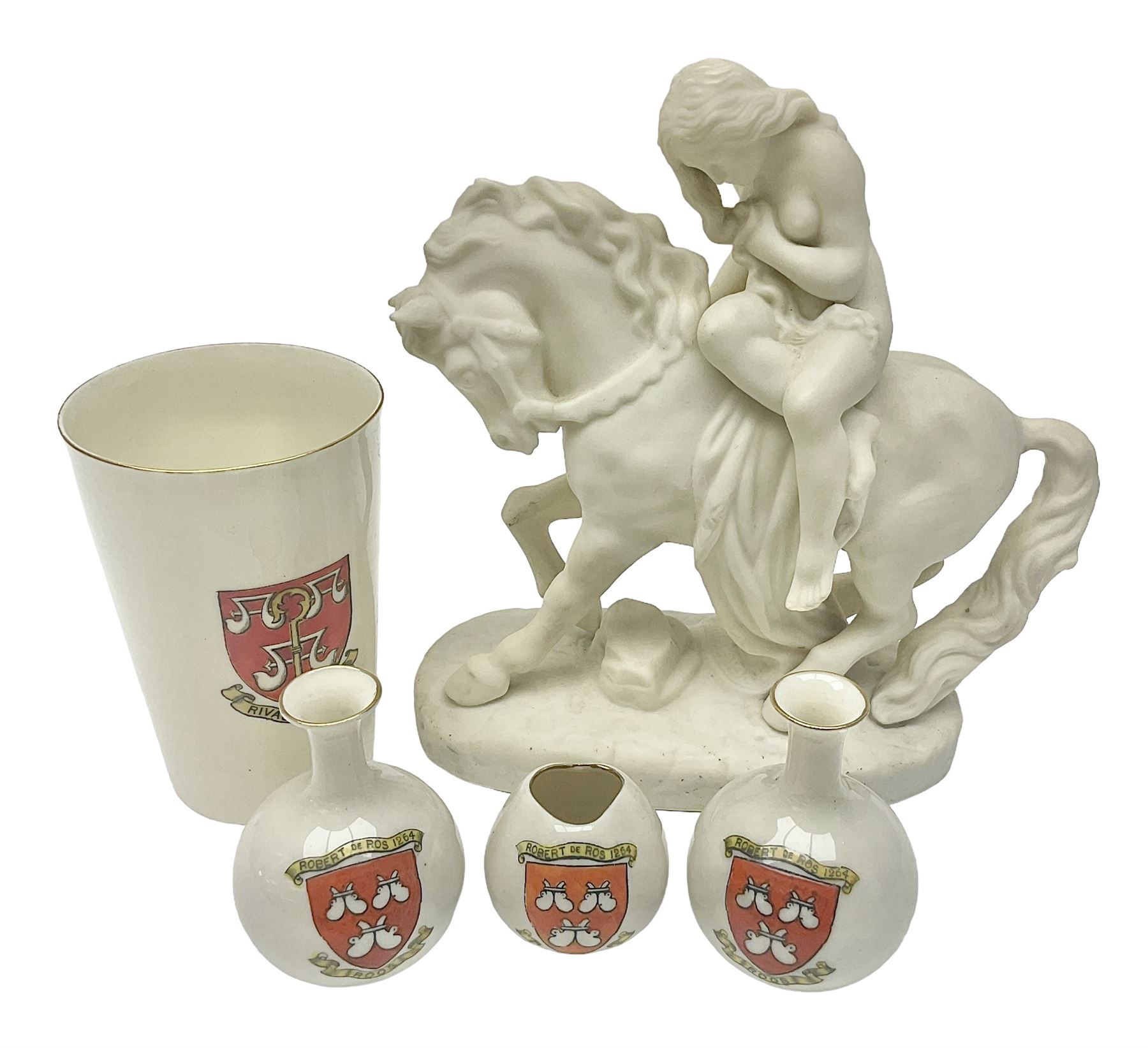 W.H.Goss Parian figure of Lady Godiva, with printed mark beneath, together with a W.H.Goss crested ware Rivaulx Abbey tumbler, and three similar Waterfall Heraldic China crested ware items, Godiva H19cm 