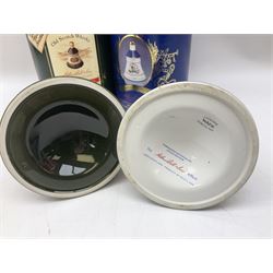 Bells, Scotch whisky, in seven Wade ceramic decanters, comprising two Christmas decanters 1990 and 1991, 60th birthday of Queen Elizabeth II decanter, Golden Wedding anniversary of the Queen and the Duke of Edinburgh decanter, Birth of Princess Beatrice decanter, Birth of Princess Eugenie decanter and Queen's mothers, together with Bells, blended Scotch whiskies, three miniatures in Wade ceramic decanters, various contents and proofs