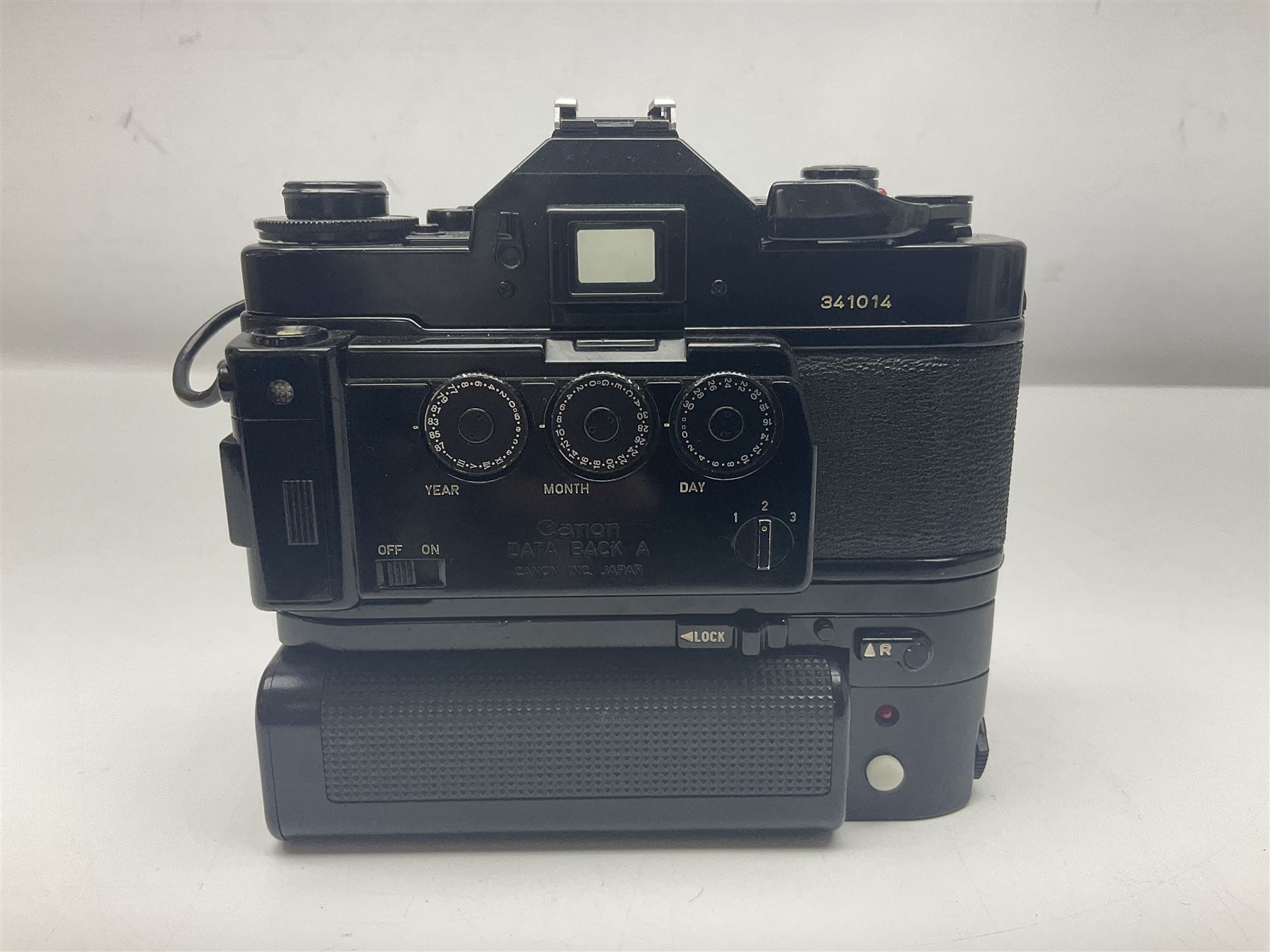 Canon A-1 camera body, serial no. 341014, with 'Canon FD 50mm 1:1.4 S.S.C.' lens, serial no. 12077119 and motor drive MA