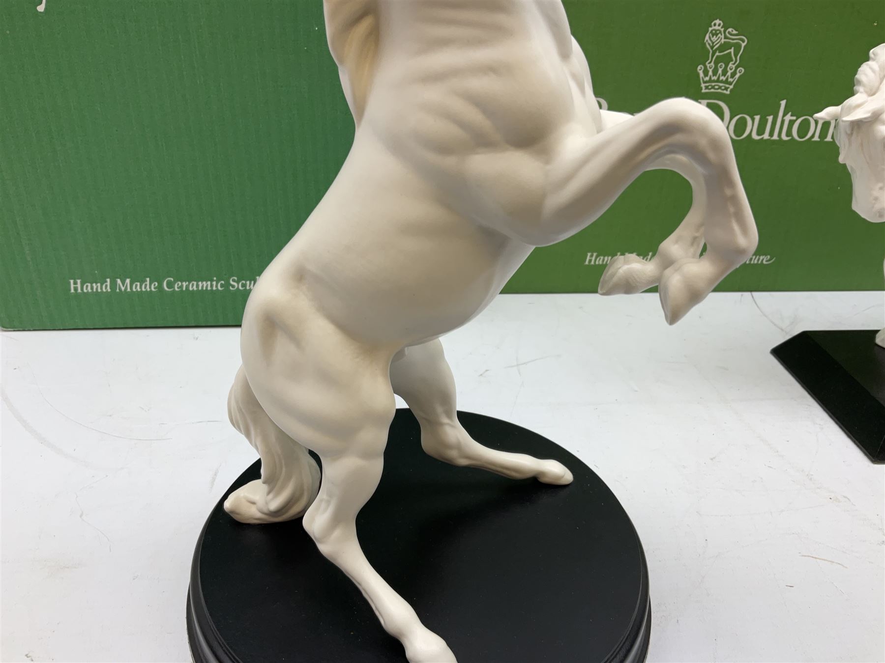 Five Beswick and Royal Doulton horse figures in matt white on black plinths, comprising of  Spirit of Affection no. 2689/2536, Springtime no.2837, Spirit of peace no.2916, Spirit of earth no.2914 and Spirit of the wild no. 183, together with a composite figure of a horse (6)