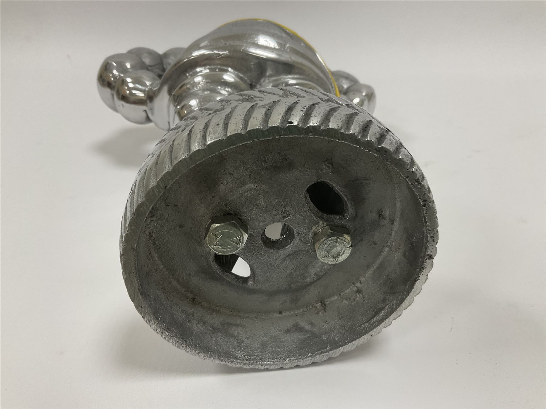 Polished aluminium Michelin man style figure, H38cm.