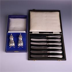 Pair of silver cruets, of baluster form and upon four pad feet, hallmarked Laurence R Wats...