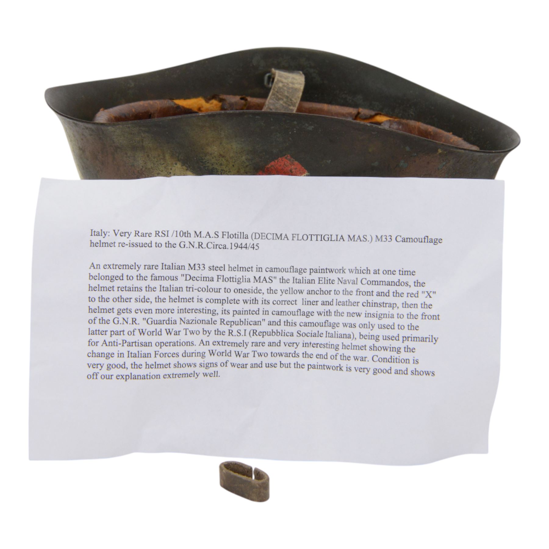 Italian RSI/10th M.A.S. Flotilla (Decima Flottiglia MAS). M33 Camouflage helmet- re-issued to the G.N.R. Circa.1944/45
extremely rare Italian M33 steel helmet in camouflage paintwork which belongd to the famous 'Decima Flottiglia MAS' the Italian Elite Naval Commandos. The helmet retains the Italian tri-colour to oneside, the yellow anchor to the front and the red X to the other side. the helmet is complete with its correct liner and chinstrap. When it was re-isseued it was painted in camouflage with the new insignia to the front of the G.N.R. 'Guardia Nazionale Republican' and this camouflage was only used to the latter part of WWII by R.S.I (Repubblica Sociale Italiana)   