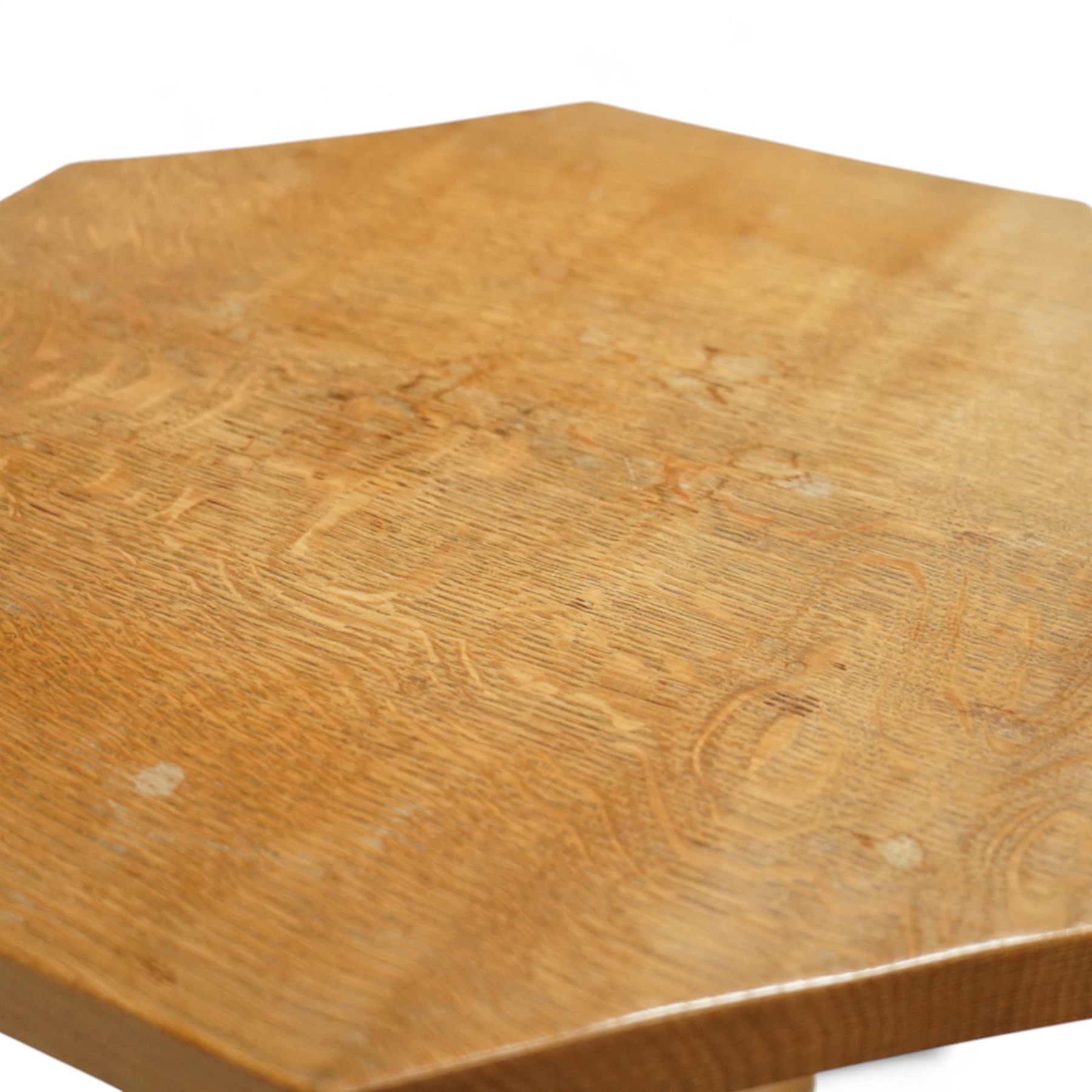 Mouseman - octagonal occasional table, raised on a cruciform base with arched supports, carved with signature mouse to one side, by the workshop of Robert Thompson, Kilburn