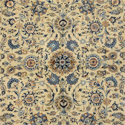 Persian Kashan carpet, beige ground, field with an all-over design of scrolling palmettes and floral sprays in blue and terracotta within a ivory ground and pale blue floral border