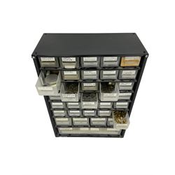 35 draw container of miscellaneous watch and clock parts including watch screws, balance wheels, barrel bushes, pocket watch springs, pocket and wrist watch mainsprings, fusee chains, and long case hands.