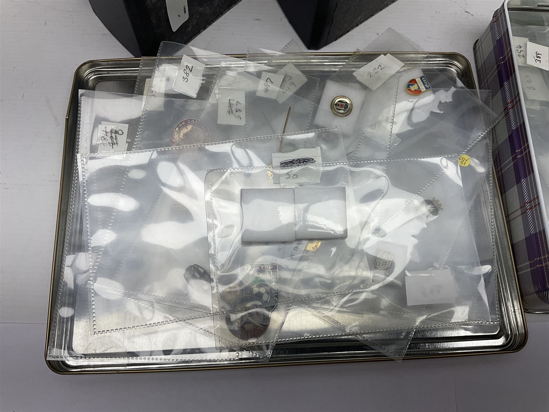 Large collection of approximately one hundred and eighty enamel badges and pins, relating to British and World football clubs, including loose examples and examples housed in folders, mostly identified