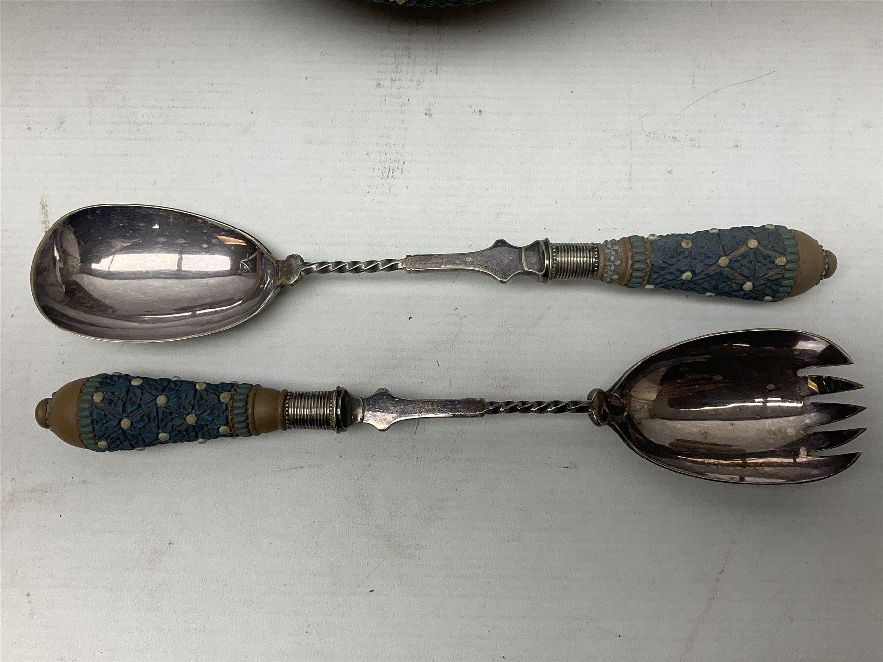 Five pieces of Doulton Lambeth silicon, comprising  salad bowl with plate mounted rim and handles, a pair of similar salad servers, vase and jug, jug H16cm