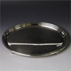 Modern silver tray, of oval form with stepped rim and upon four pad feet, hallmarked Victorian Silverware Ltd, Birmingham 2000, W28.5cm