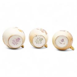 Royal Worcester blush ivory porcelain to include a pair of jugs, no. 1094, pair of vases, no. 1021, and a small ewer no. 1094 (5)