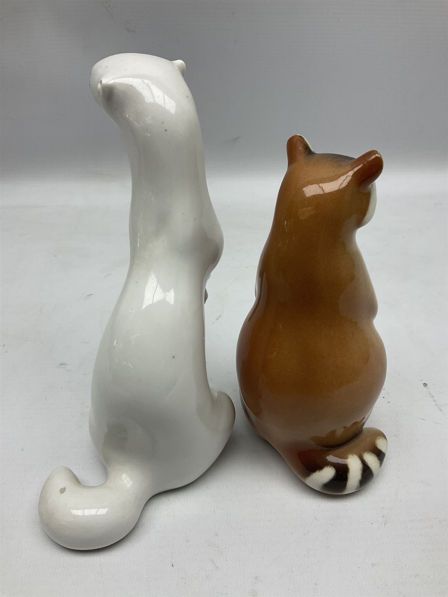 1970's Hornsea mugs, comprising Train Robber pattern designed by John Clappison and Owl from the ‘Newsprint’ Zoo range designed by Jack Dadd, and three USSR figures of animals comprising raccoon, ferret and badger