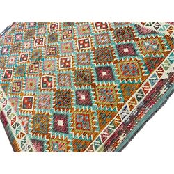 Anatolian Turkish Kilim multi-colour rug, decorated with all over lozenges in contrasting colours with ivory outline, the multi-band ivory border with repeating geometric shapes and small lozenges or diamonds