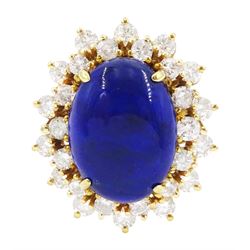 18ct gold lapis lazuli and diamond cluster ring, single oval cut lapis lazuli with two rows of round brilliant cut diamonds, stamped 750, total diamond weight approx 1.70 carat