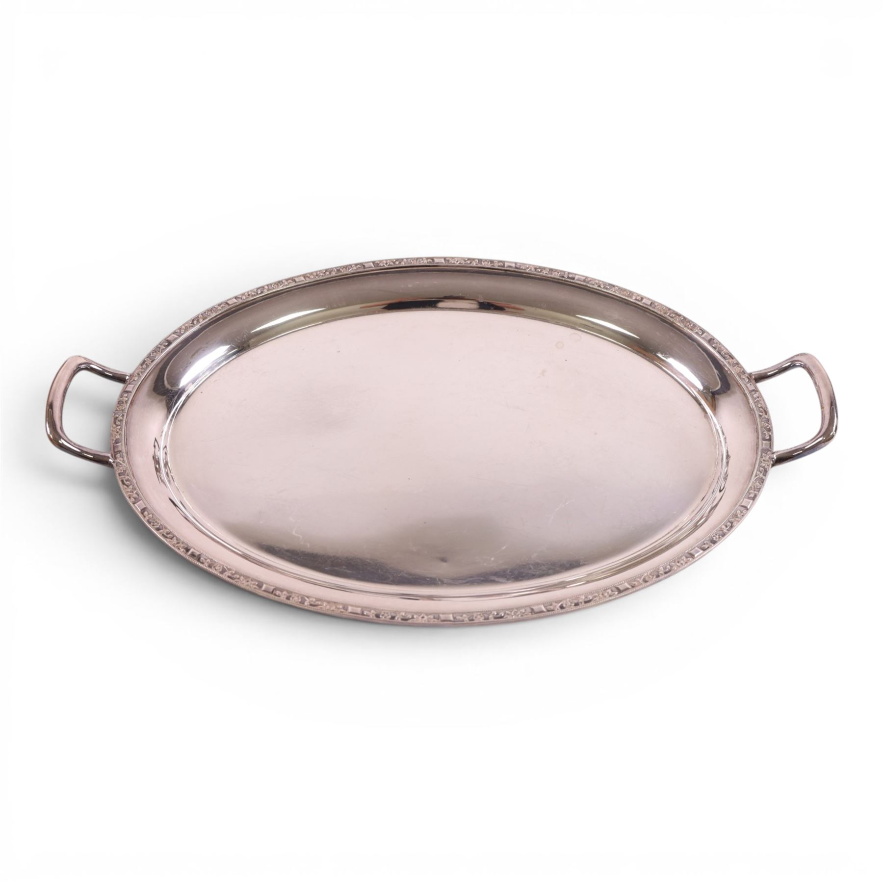 Four piece silver plated tea service, comprising teapot, hot water jug, milk jug and open sucrier, together with serving tray, toasted cheese dish, sugar tongs and pair of candle sticks 