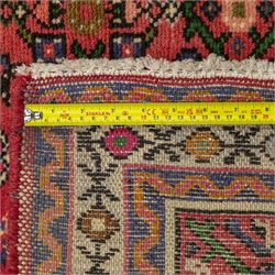 North West Persian runner, red field decorated with repeating herati motifs and small flowerheads, enclosed by cream main border with stylised floral motifs and narrow guard borders, fringed ends