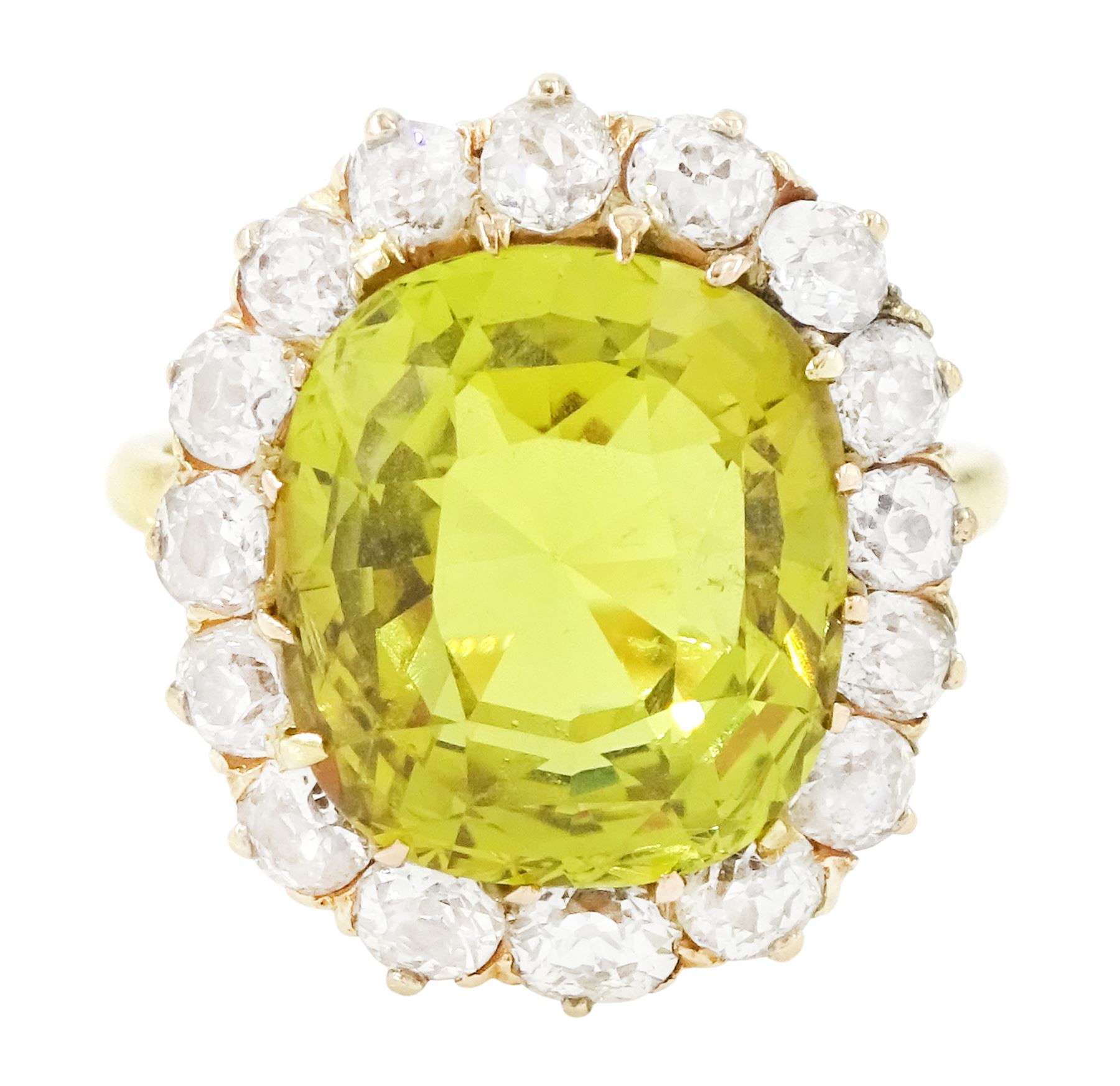 Early 20th century gold chrysoberyl and diamond cluster ring, single cushion cut yellow / green chrysoberyl of approx 8.00 carat, surrounded by sixteen old cut diamonds, stamped 18ct, total diamond weight approx 1.10 carat