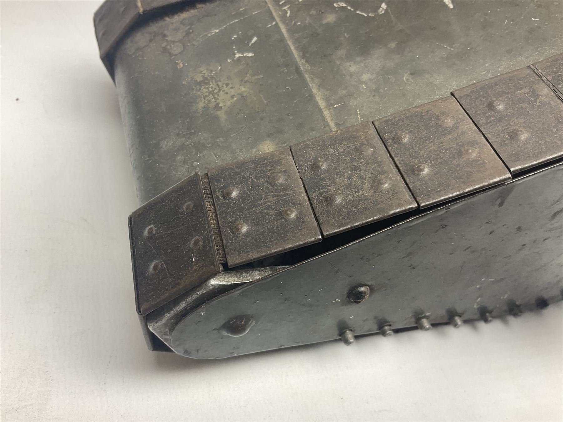 Large clockwork model of a WW1 Tank made of tin-plate and aluminium, with moving side cannons, the clockwork chain driven movement driving the articulated tin tracks; L28.5cms  W16.5cms and H13.5cms