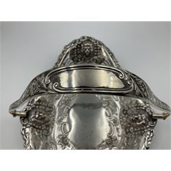 Edwardian silver swing handled basket, of navette form, with four repousse lion masks to each corner and with pierced and embossed floral, scroll and shell decoration to sides, base and handle, hallmarked Charles Horner, Birmingham 1906, height including handle H20cm