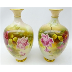  Pair Royal Worcester baluster vases, painted with roses amongst foliage by J. Llewellyn, c1916, H27cm   