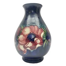 Moorcroft Anemone pattern vase of baluster form, upon a blue ground, with painted and impressed marks beneath, H24cm