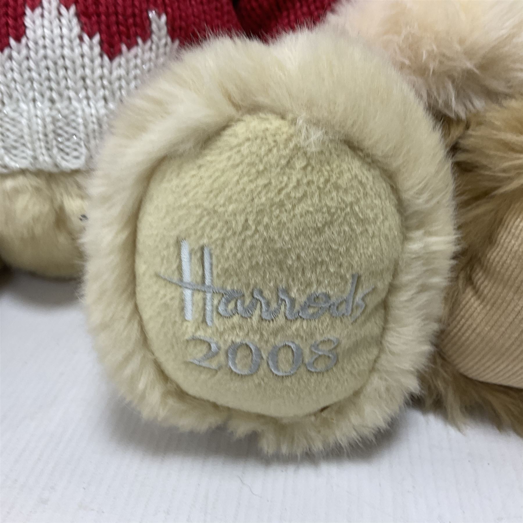 Six Harrods annual teddy bears, dating between 2005 and 2010, including 20th anniversary edition bear, tallest H39cm