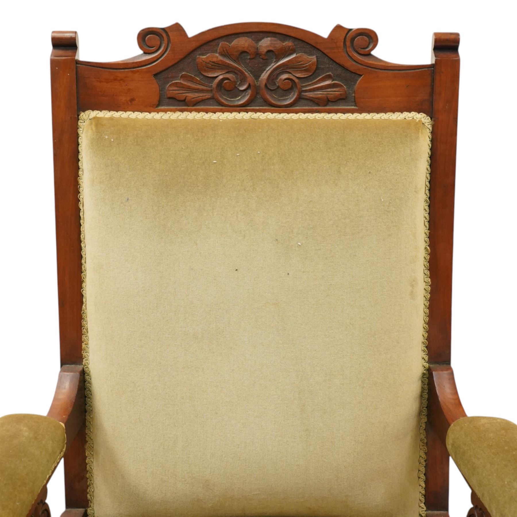 Pair of late Victorian mahogany carved open armchairs, with carved cresting rail, above upholstered seat, back and arms, raised on turned supports terminating in castors