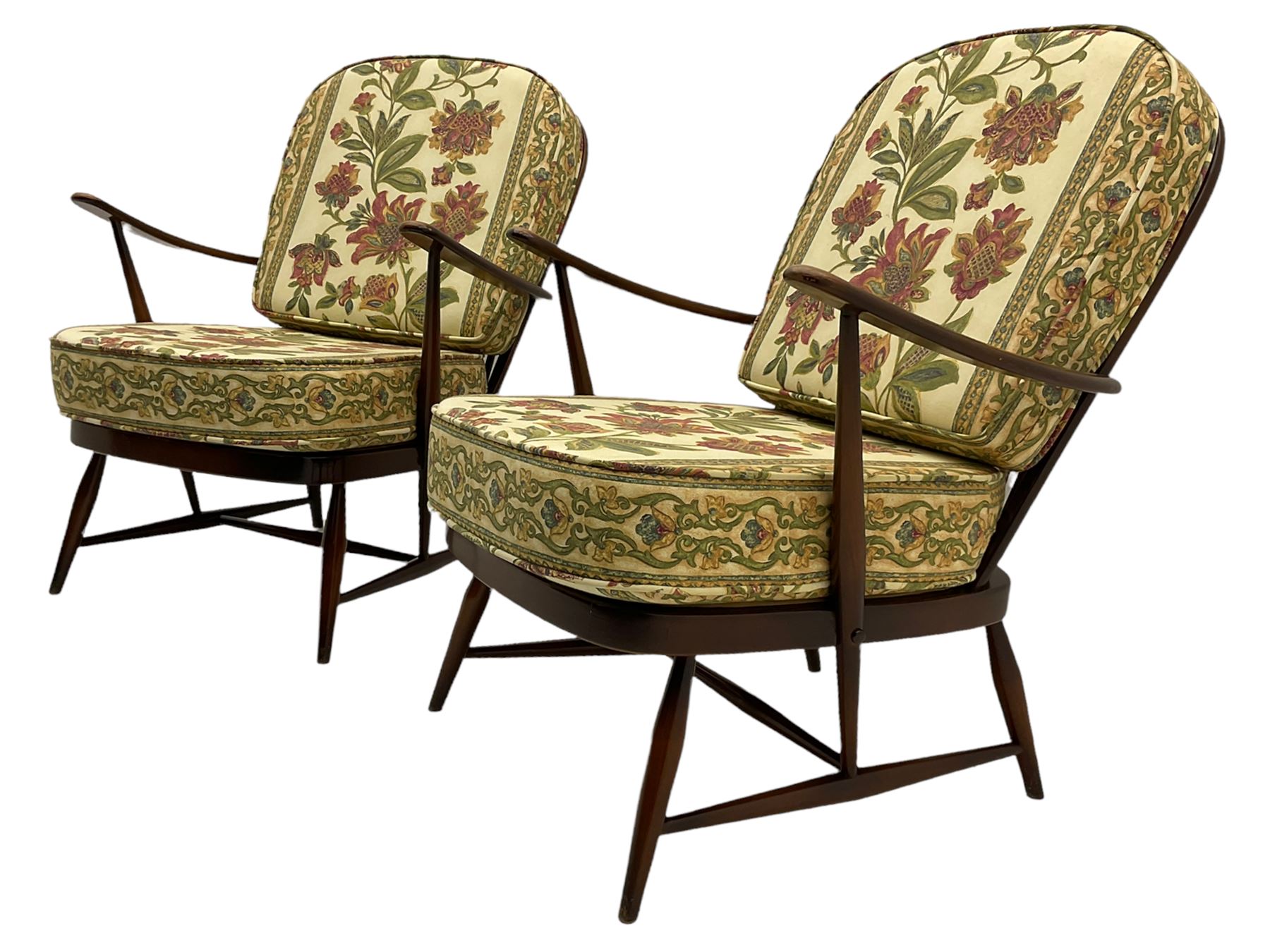Ercol - Pair of mid-20th centur medium elm framed easy chairs, with loose patterned covers with folate design