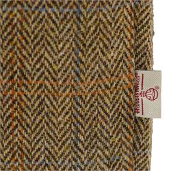 Tetrad - 'Matisse' snuggler armchair or loveseat, Chesterfield shape with rolled arms flanking a serpentine back and front, upholstered in herringbone pattern Harris Tweed and tan leather with close-nailed studwork, on turned feet