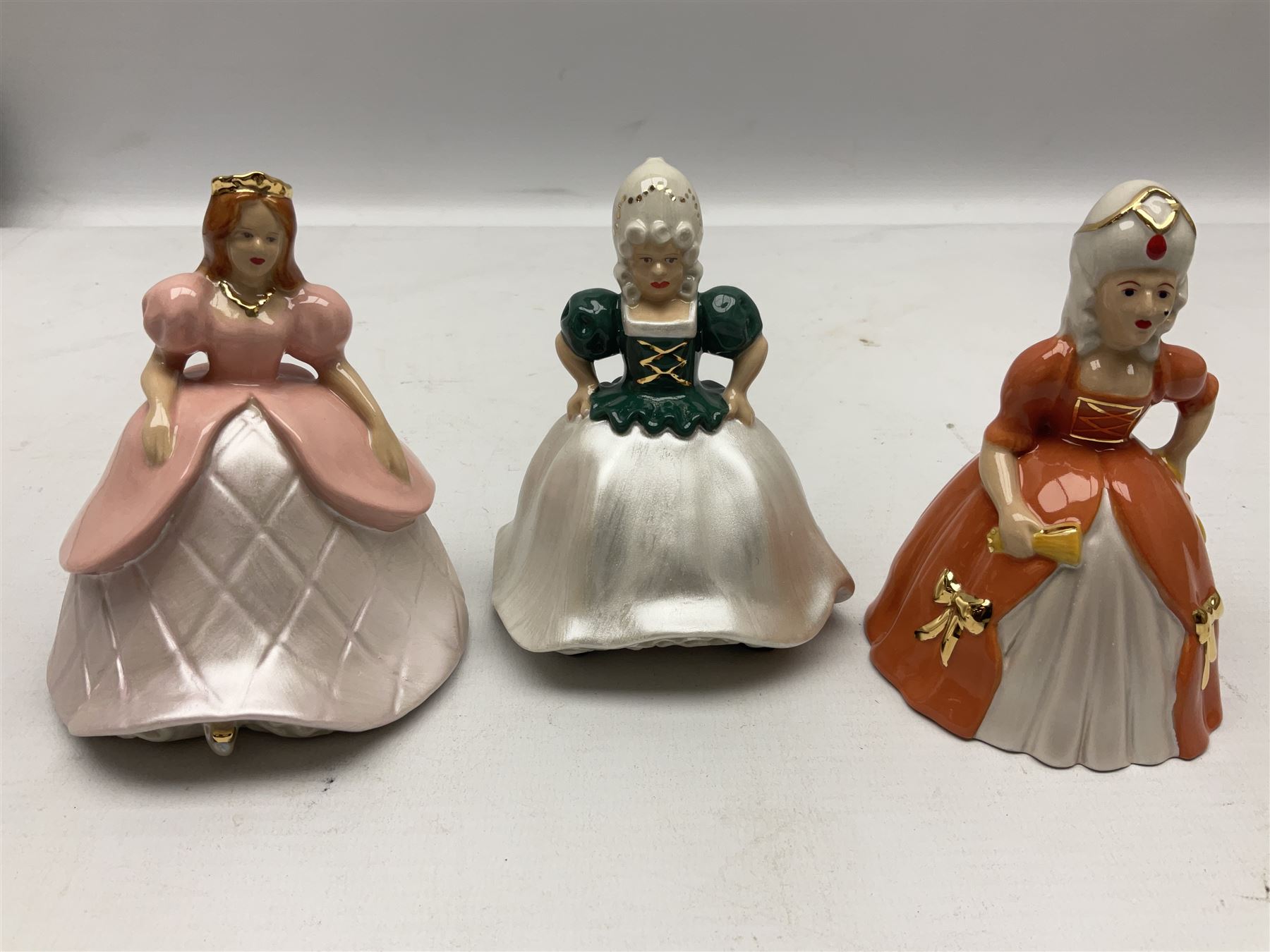 Thirteen Wade Collectors Club figures, comprising six Alice in Wonderland figures; Queen of Hearts, Alice, Mad Hatter, The Doormouse, White Rabbit and Cheshire cat, six Cinderella figures; Fairy Godmother, Cinderella Ready for the Ball, Prince Charming, Cinderella, Clorinda and Thisbe, together with Beauty from Beauty and the Beast, all with original boxes  